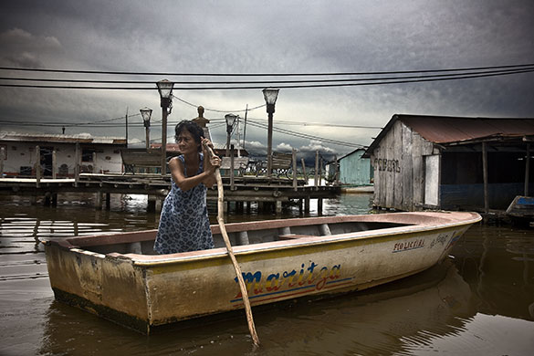 Venezuela lightning: A resident of Congo Mirador uses a boat on Lake Maracaibo