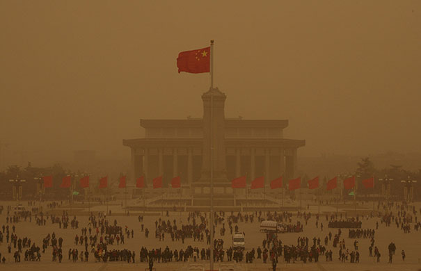 24 Hours in Pictures: Tiananmen Square is seen amid a sandstorm in Beijing