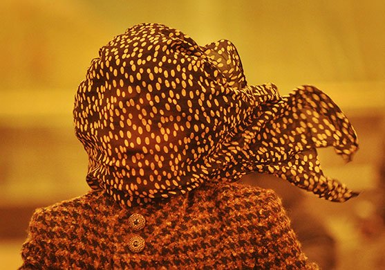 Sandstorms in China: A woman covers her face against a sandstorm in Tianjin municipality