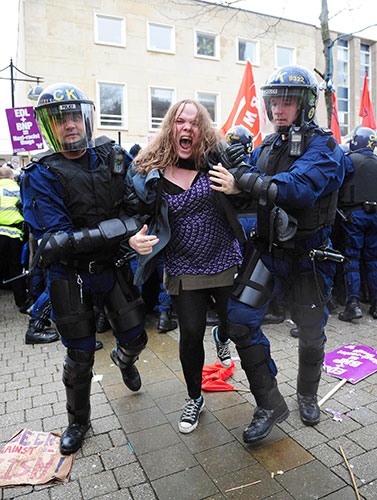 EDF march in Bolton: A Unite Against Facism protester is taken away by police 