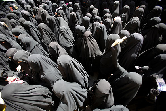 24 hours in pictures: Veiled women take part in a protest outside the Yemeni parliament in Sanaa