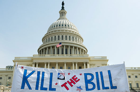 Healthcare reform: Supporters of the Tea Party movement hold a sign outside the US Capitol