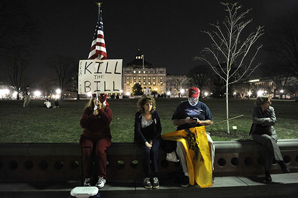 Healthcare reform: Protestors remain late in the evening after a 'Kill the Bill' rally