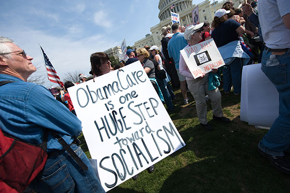 Healthcare reform: A supporter of the Tea Party movement holds a sign outside the US Capitol