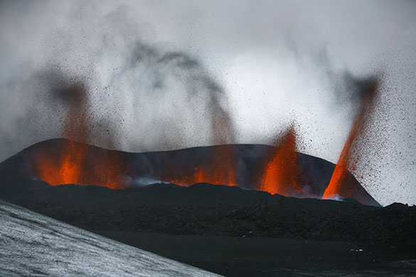 24 hours in pictures: Lava spews out of a mountain