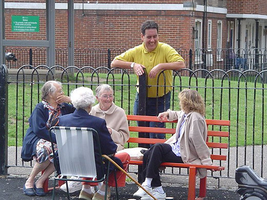postively public housing: Peckwater Estate Kentish Town old people sitting on a bench 