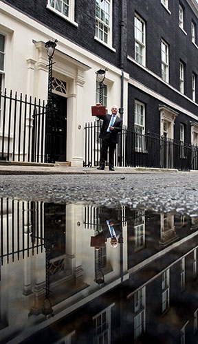 24 hours in pictures: Alistair Darling holding budget box at number 11 Downing Street