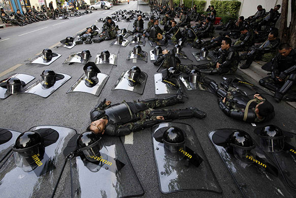24 hours in pictures: Soldiers rest near the parliament in Bangkok