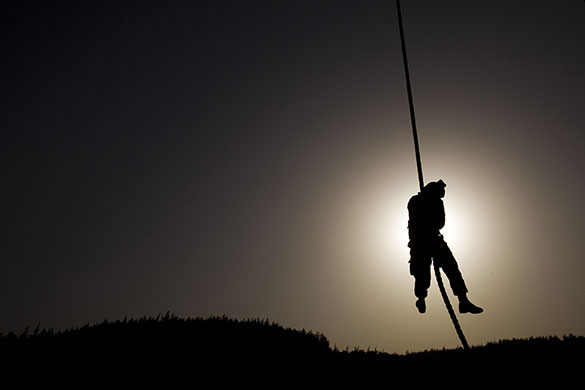 24 hours in pictures: An Israeli soldier rappels during a drill in an army base