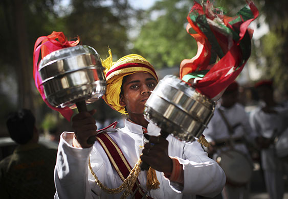 24 hours in pictures: An Indian musician shakes rattles