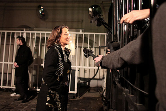 24 hours in pictures: Segolene Royal addresses journalists through the fence Paris