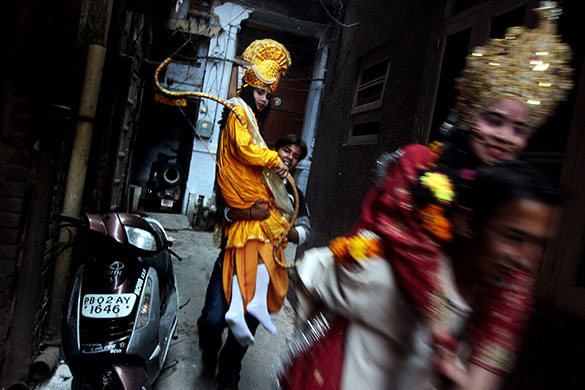 24 hours in pictures: RamnaAmritsar, India: Devotees carry children dressed as Hindu Gods