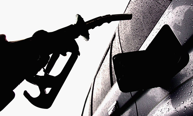 week in business: A motorist fills up car with petrol