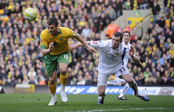 Norwich v Leeds: Chris Martin gets infront of Neil Collins 