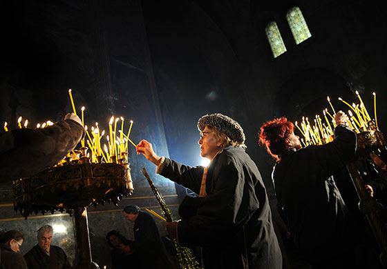 24 hours in pictures: Bulgarian Orthodox believers light candles during the Palm Sunday service