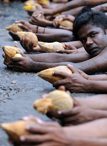 24 hours in pictures: A Sri Lankan Tamil Hindu devotee outside a Hindu temple in Colombo