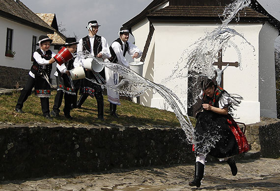 eyewitness: Girl runs as boys throw water at traditional Easter celebrations in Holloko