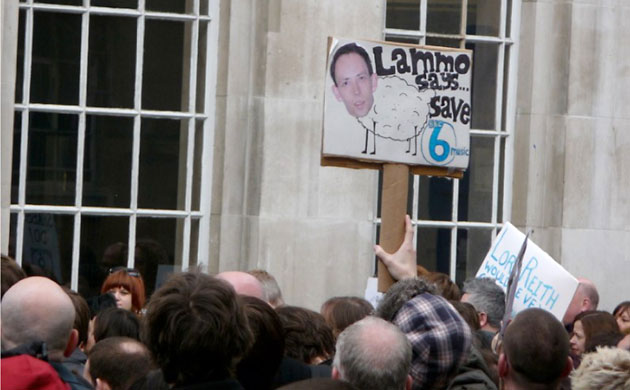 Save 6 Music protest: A protester holds up a picture of DJ Steve Lamacq - who is in New York