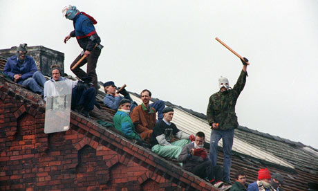 Armed prisoners prepare for their second night of a siege at Strangeways prison in April 1990.