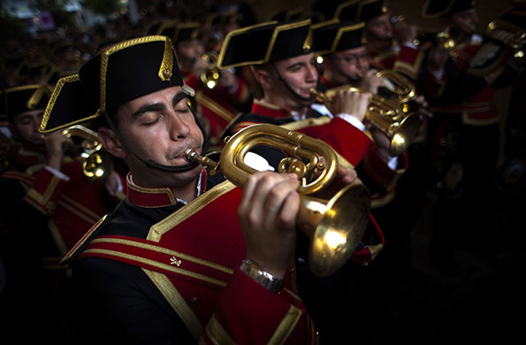 24 hours in pictures: Seville, Spain: Musicians from the El Despojado brotherhood