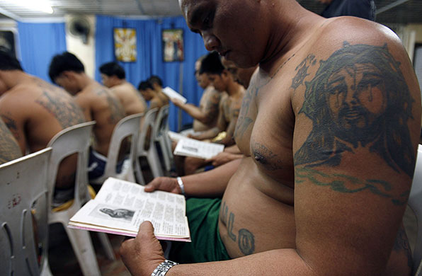 24 hours in pictures: Makati city, Philippines: Prisoners sing and chant the passion of Christ 