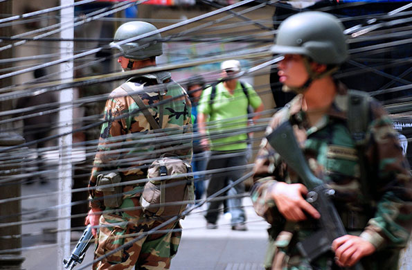 Chile security: Soldiers stand guard in the streets of Concepcion, Chile