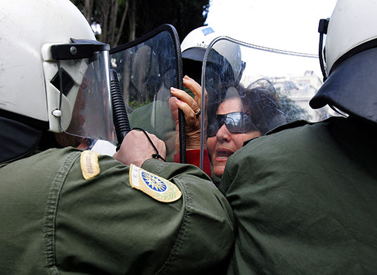 Greece protests: Pensioners try to brake through the police barrier, Athens, Greece