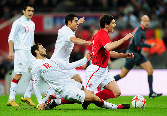 England v Egypt: Gareth Barry feels the full force of Hossam Ghaly's tackle