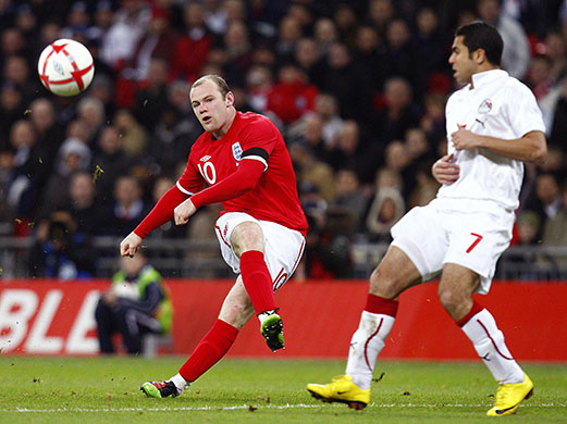 England v Egypt: Wayne Rooney tries a curling shot from the edge of the box