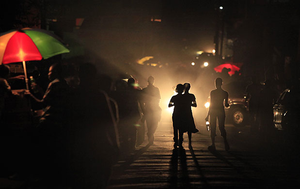 24 hours in pictures: Port-au-Prince, Haiti: People walk along a street