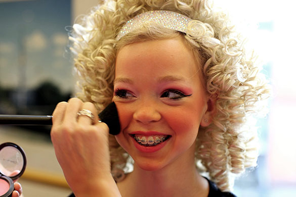 Irish Dance Championships: A dancer has her makeup applied before competing