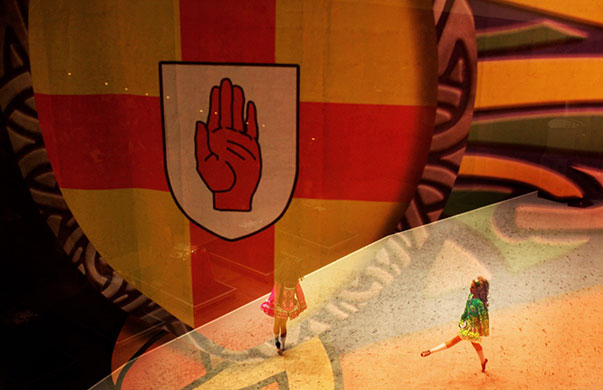 Irish Dance Championships: Dancers through a stage backdrop at the World Irish Dance Championships