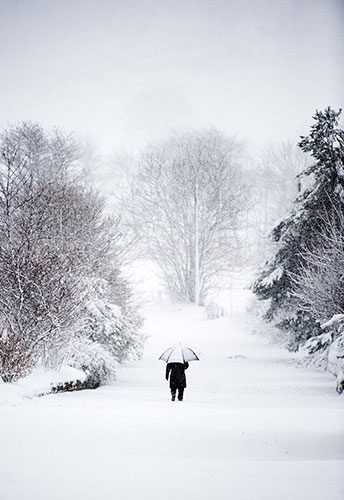 Scotland snow: A man walks through heavy snow in the town of Penicuik, Scotland