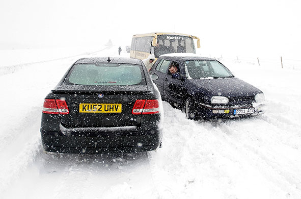 Scotland snow: Traffic builds as heavy snow blocks road south of Edinburgh, in Scotland,