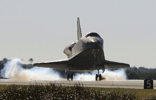 Week in Business: The space shuttle Atlantis lands at the Kennedy Space Center