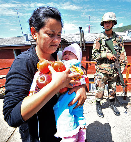 Chile Aid: March 3, 2010: A woman receives foods in Constitucion, Chile