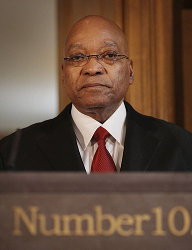 Zuma visits UK: Jacob Zuma listens during a news conference in number 10 Downing Street