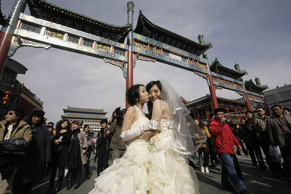 Gay weddings: Lesbians pose for their 'wedding photographs' in Beijing