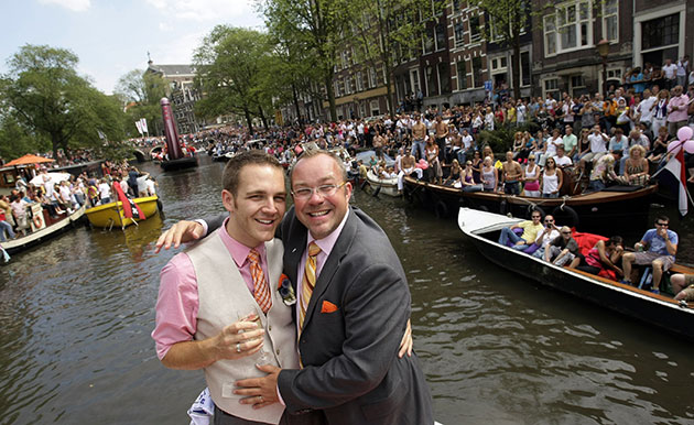 Gay weddings: Wedding ceremony on a boat at the Gay Pride canal parade in Amsterdam