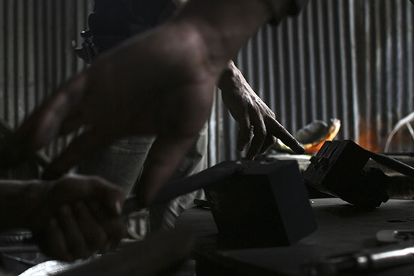 24 hours in pictures: Jabaliya, Gaza: Palestinian workers recycle metal