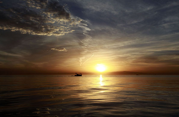 24 hours in pictures: A fishing boat is seen in the Bay of Algiers