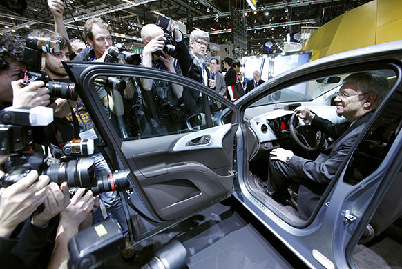 Week in business: Nick Reilly, Chief Executive of Opel and Vauxhall poses in a new Meriva car