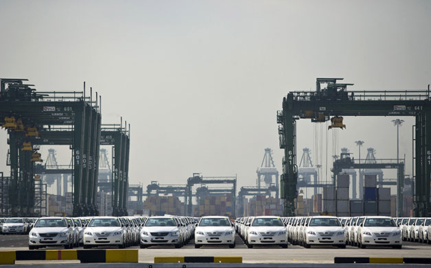Week in business: New Toyota cars lined up on the quay in the port of Singapore