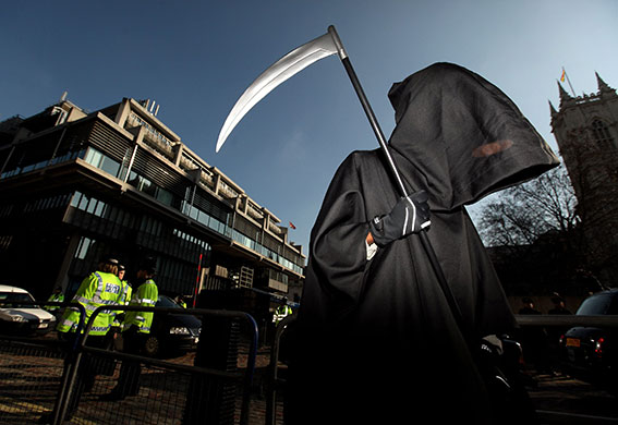 Iraq Inquiry: A protester dressed as the grim reaper demonstrates outside the Inquiry
