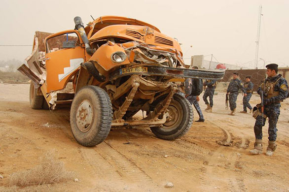 Iraq elections build up: Iraqi security forces inspect an explosives-laden truck