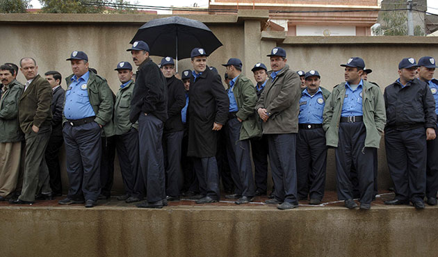 Iraq elections build up: Policemen wait to vote outside a polling station in Sulaimaniya