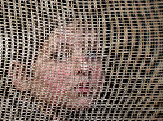 24 hours in pictures: Srinagar, India: A Kashmiri boy watches a funeral procession for a militant