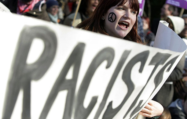 Geert Wilders in London: A protestor holds an anti-fascist banner