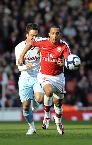 Arsenal v Burnley: Theo Walcott uses his pace to speed past Danny Fox