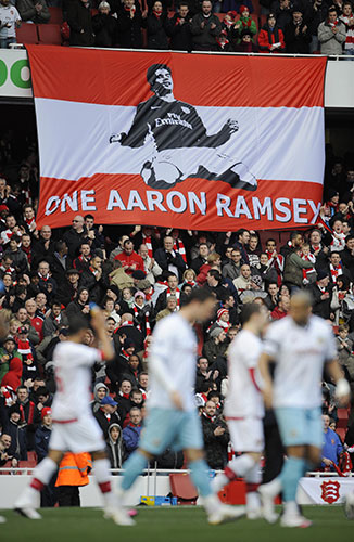 Arsenal v Burnley: The Arsenal fans unfurl a banner in honour of the injured Aaron Ramsey